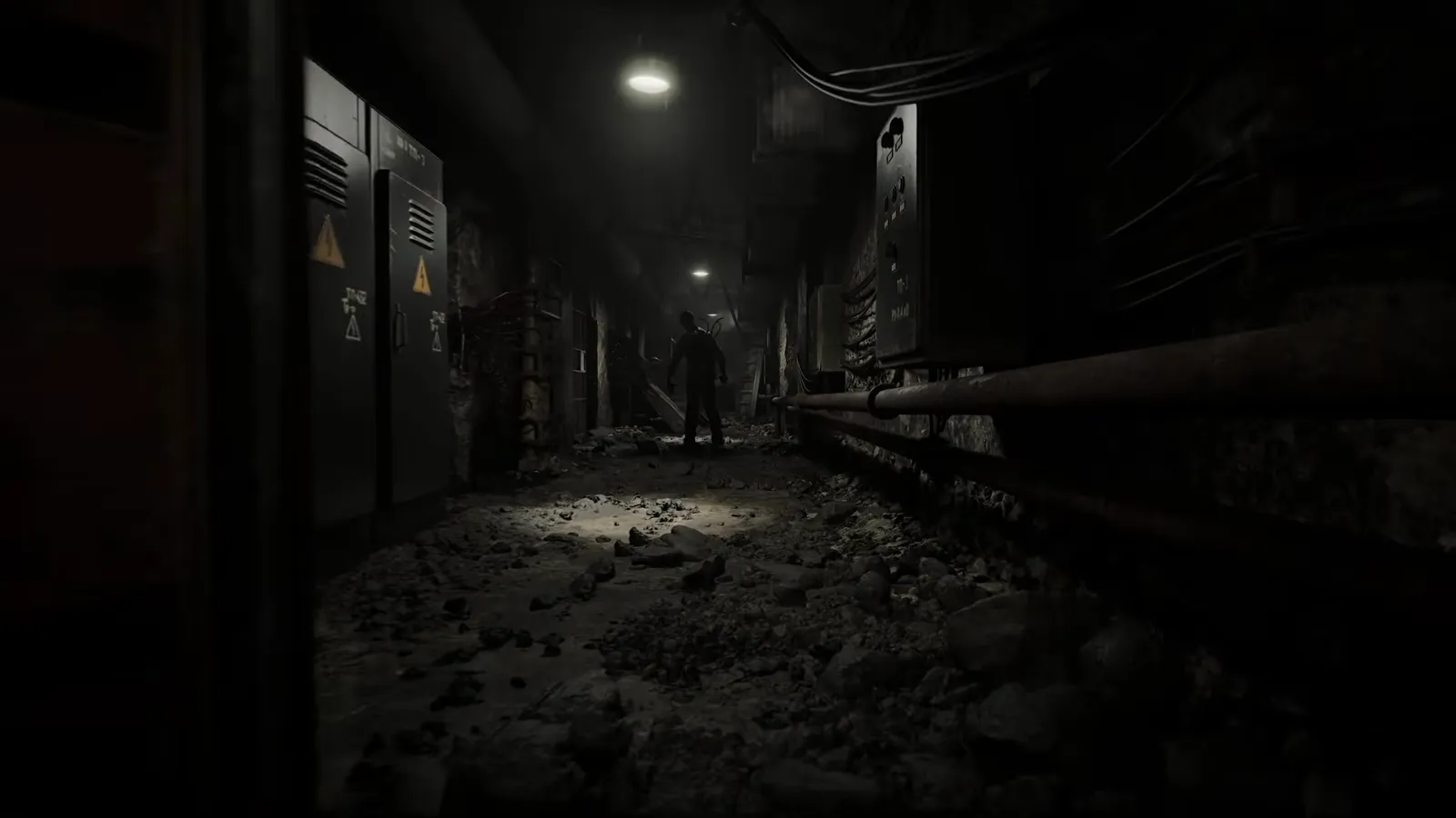 Dark hallway lined with metal cabinets and a faint humanoid figure visible at the far end under weak lighting